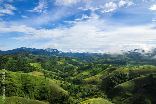 Beautiful sunlight and blue sky with cloud over the mountain of Thailand.