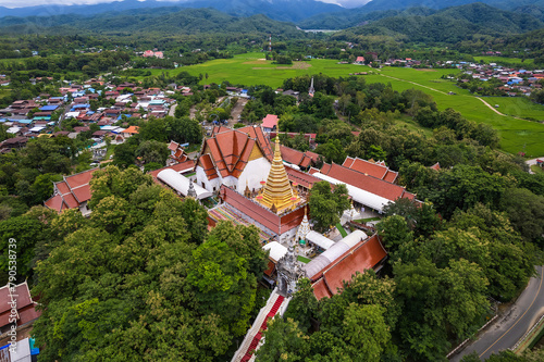 Golden pagoda at Wat Phra That Cho Hae Temple in Phrae province, north of Thailand. photo