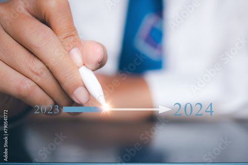 Businessman pointing target in 2024. Progress growing potential success new business.