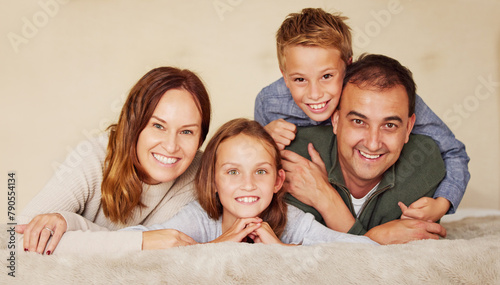 Happy, family and children in portrait on bed to relax, peace and love at home in bedroom. Connection, smile and people in house or apartment for holiday, vacation or together with hug in Spain
