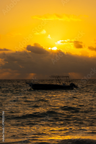 Small boat on the sea at sunrise in Punta Cana