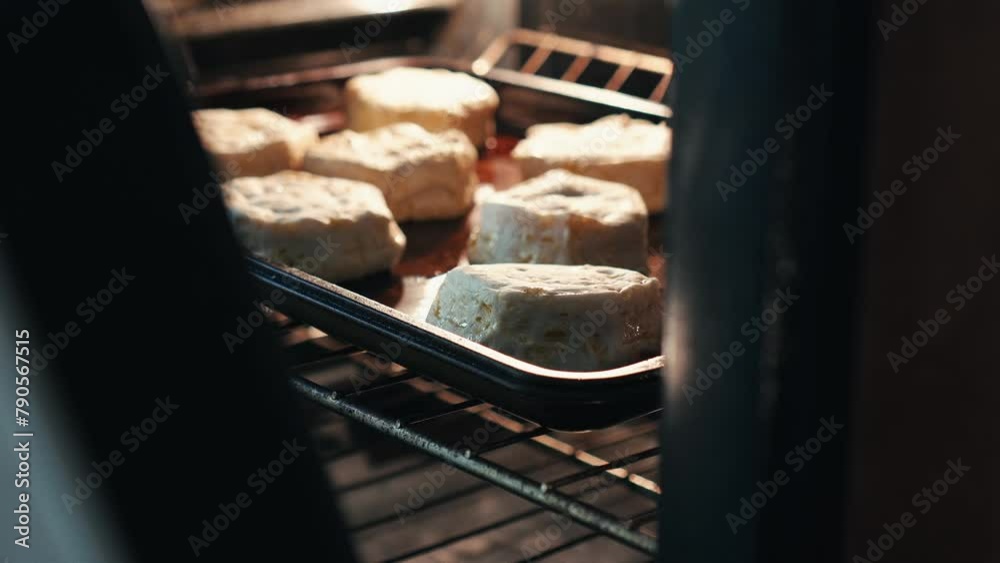 biscuits cooking in an oven 