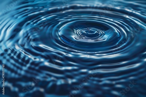 Perfect Droplet Creating Ripples in Blue Water