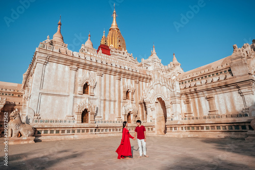 Couple visits Ananda Temple, a beautiful Burmese temple, in the morning.