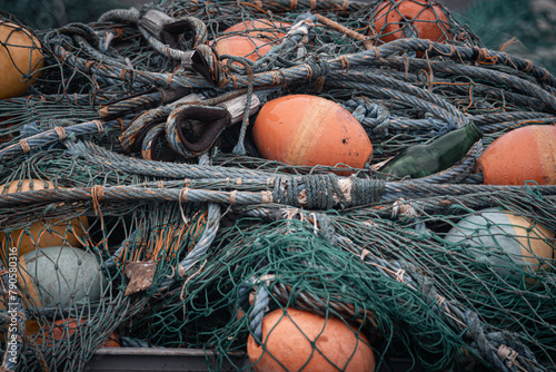 pływaki, boje,  liny i sieci kutry rybackie na morzu photo