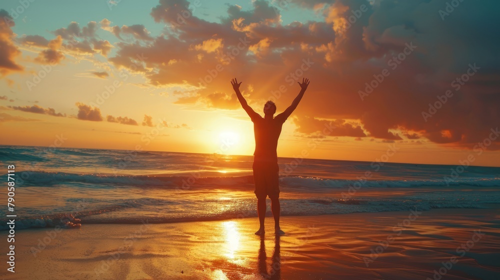 man raising arms up enjoying sunset on the beach looking morning sunrise - Self care, traveling, wellness and healthy life style concept