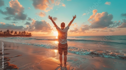man raising arms up enjoying sunset on the beach looking morning sunrise - Self care, traveling, wellness and healthy life style concept photo