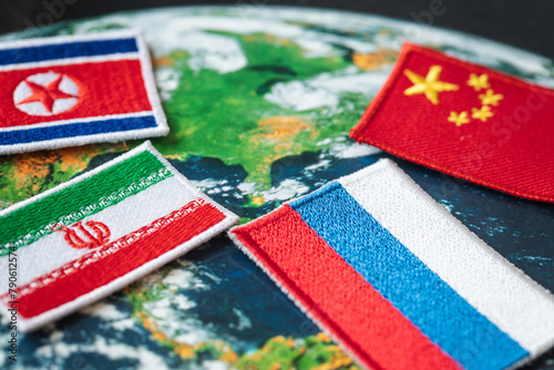 Symbols of Russia, China, North Korea and Iran against the background of the world, the concept of alliance and cooperation between countries