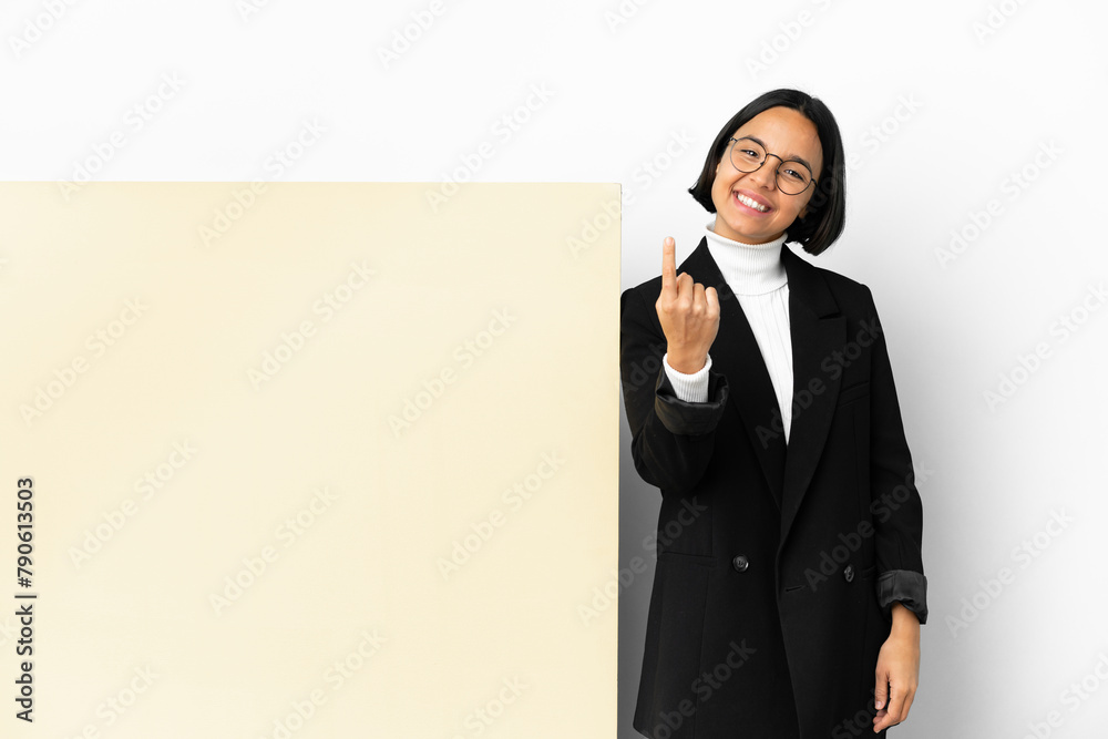 Young business mixed race woman with with a big banner over isolated background doing coming gesture Young business mixed race woman with with a big banner over isolated background doing coming gesture
