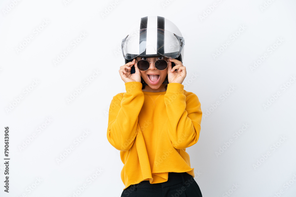 Woman with a motorcycle helmet with glasses and surprised Woman with a motorcycle helmet with glasses and surprised