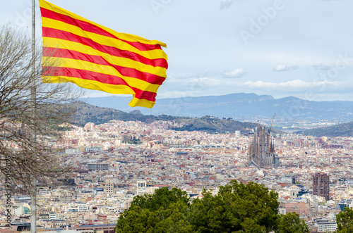 Barcelona, Spain: aerial view from Montjuic to the city of Barcelona with Sagrada Familia and flag of Catalonia