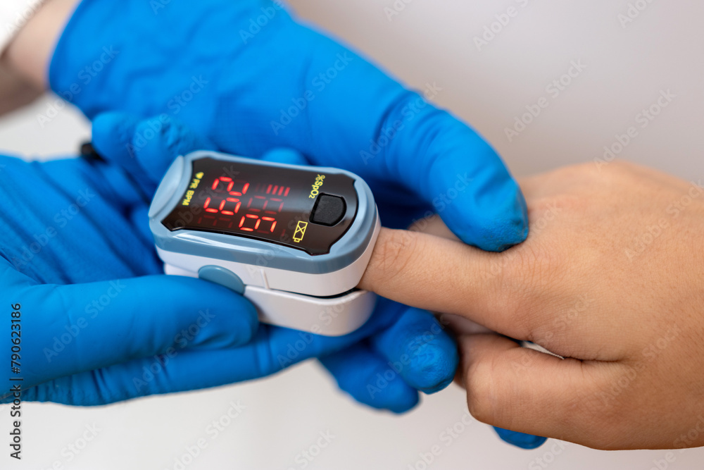 The child's saturation is measured using a pulse oximeter. The child's saturation is measured using a pulse oximeter.