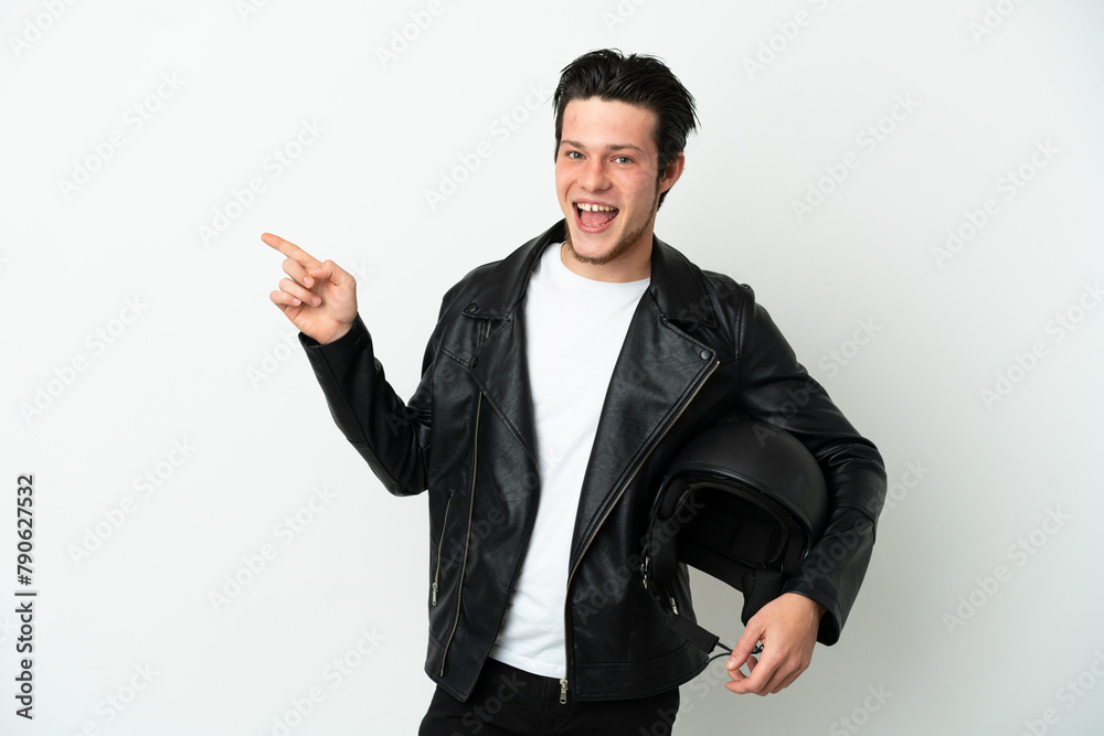 Russian man with a motorcycle helmet isolated on white background pointing finger to the side Russian man with a motorcycle helmet isolated on white background pointing finger to the side