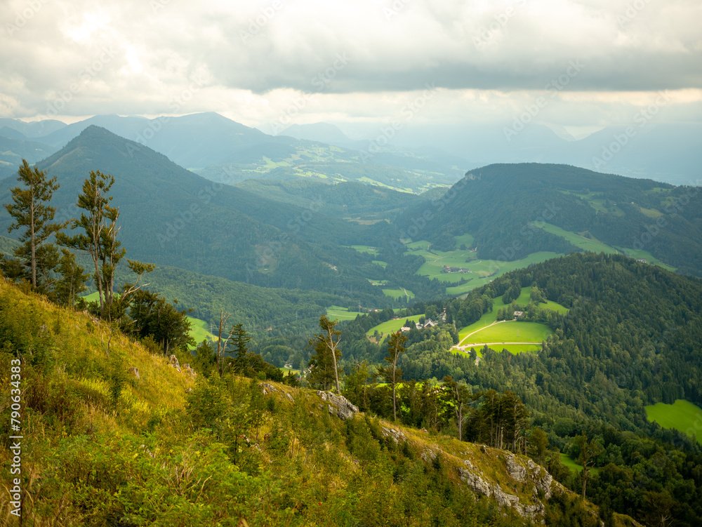 Obraz premium View from the top of the Gaisberg mountain to the valley, surrounding mountains and the city of Salzburg.