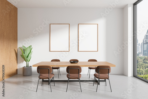 Modern home living room interior with chairs and eating table, mockup frames