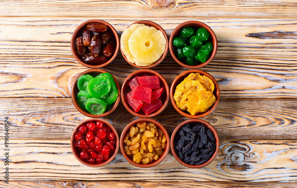 Group of dried and candied fruit in bowl Group of dried and candied fruit in bowl