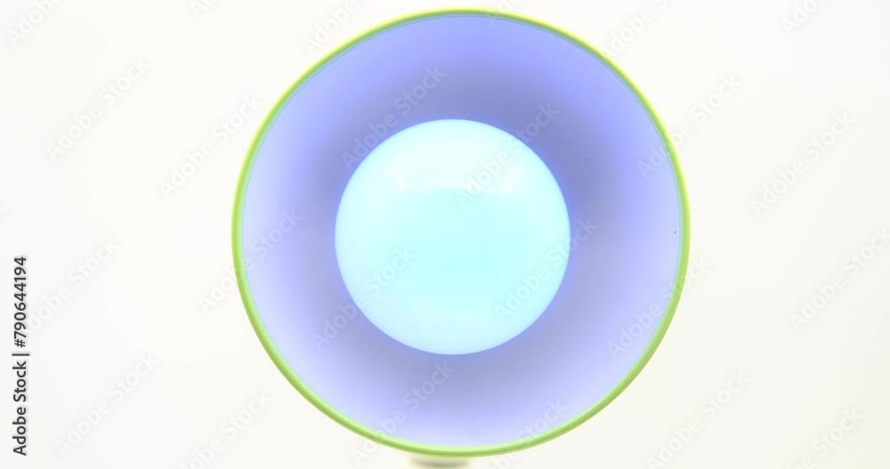 changing light colors on dark background, Smart LED bulb changing its color changing light colors on dark background, Smart LED bulb changing its color