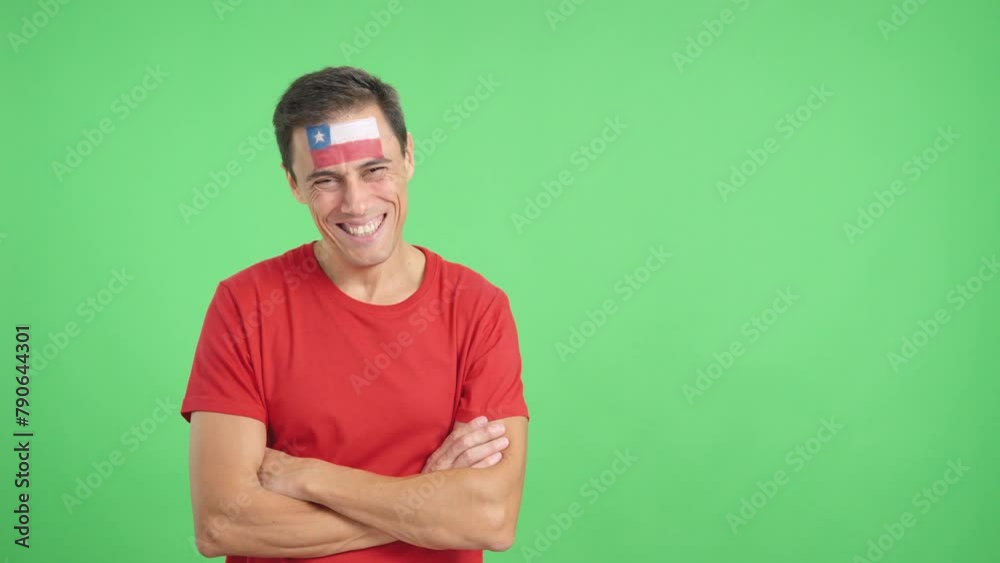 Man standing with chilean flag painted on face smiling Man standing with chilean flag painted on face smiling