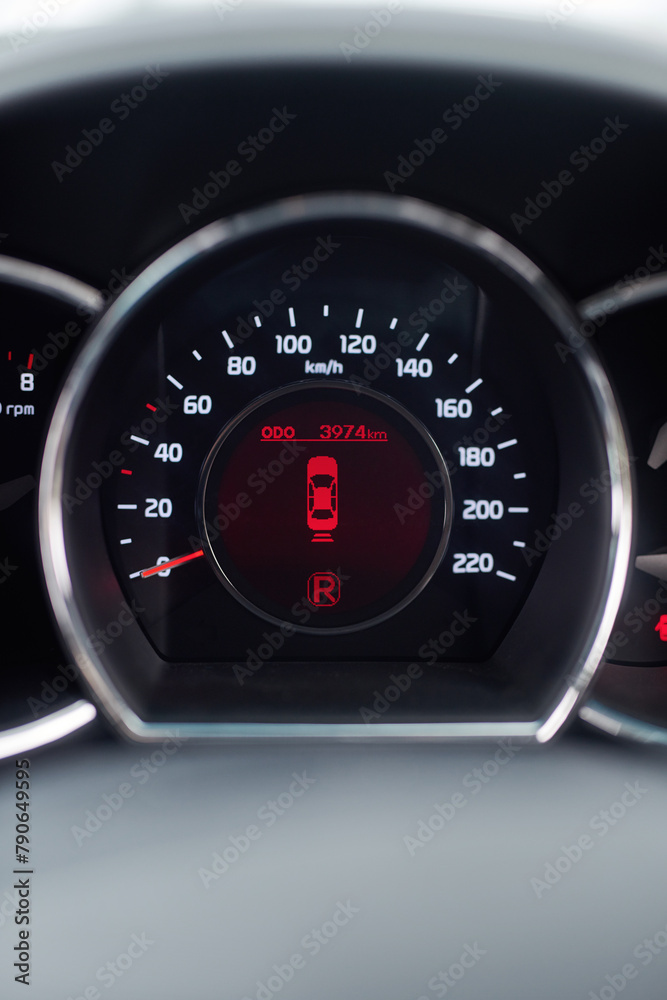 Dashboard, reverse and speedometer of car for information, safety or travel with lights closeup. Automobile, transportation and system display on vehicle interior for drive, journey or road trip Dashboard, reverse and speedometer of car for information, safety or travel with lights closeup. Automobile, transportation and system display on vehicle interior for drive, journey or road trip