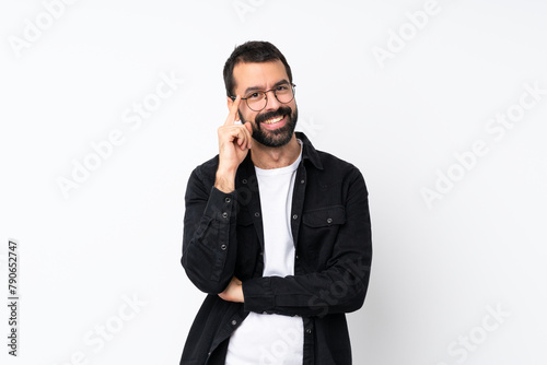 Young man with beard over isolated white background with glasses and happy