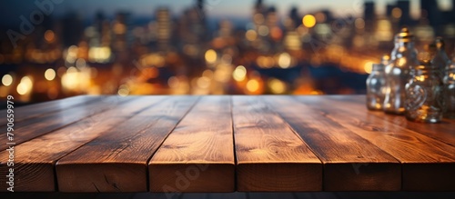 Empty wooden table for product display montages with cityscape background. photo