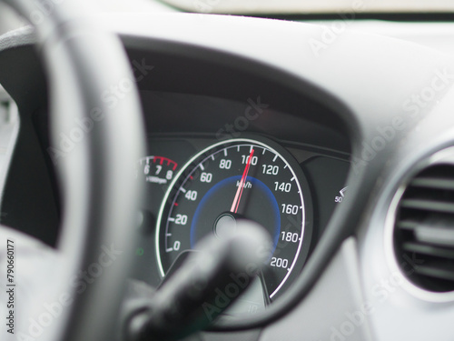 A car's speedometer shows a reading of 140 km/h