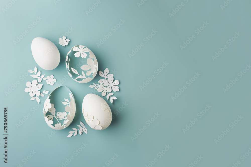 Stencil laser cut paper Easter egg on a light blue background