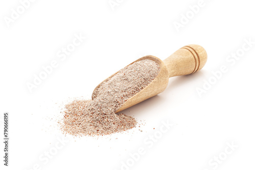 Front view of a wooden scoop filled with Organic Ragi Flour (Eleusine coracana) or Finger Millet Flour. Isolated on a white background.
