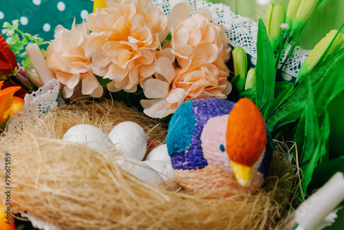 A bird perched in nest with eggs among flowers and plant petals