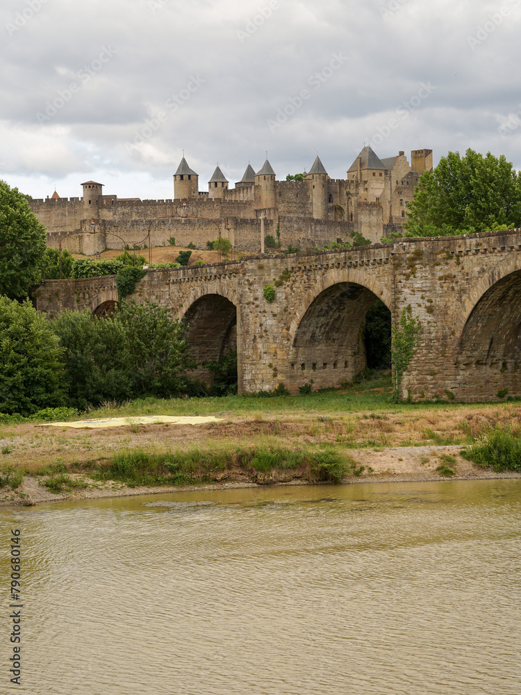Medieval bridge Pont Vieux with Carcassone castle panoramic view, popular tourist landmark in France