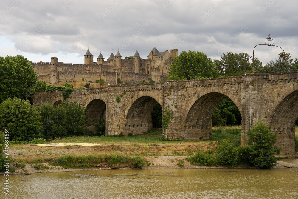 Medieval bridge Pont Vieux with Carcassone castle panoramic view, popular tourist landmark in France
