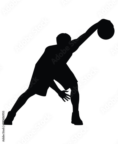 Silhouette of a basketball player who stand with the ball in hs hand and performs a crossover jab