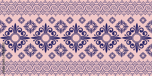 Seamless pattern with a repeating design of small blue flowers