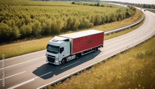 An Morocco-flagged truck hauls cargo along the highway, embodying the essence of logistics and transportation in the Morocco