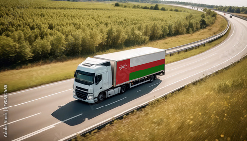An Oman-flagged truck hauls cargo along the highway, embodying the essence of logistics and transportation in the Oman