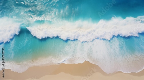 Aerial View of Gentle Waves Crashing on a Pristine Sandy Beach