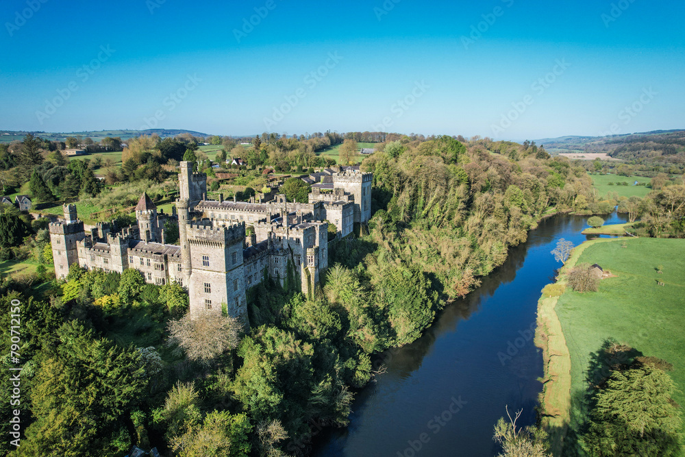 Aerial view of Lismore Castle, County Waterford, Ireland, on a tranquil spring day under a flawless blue sky