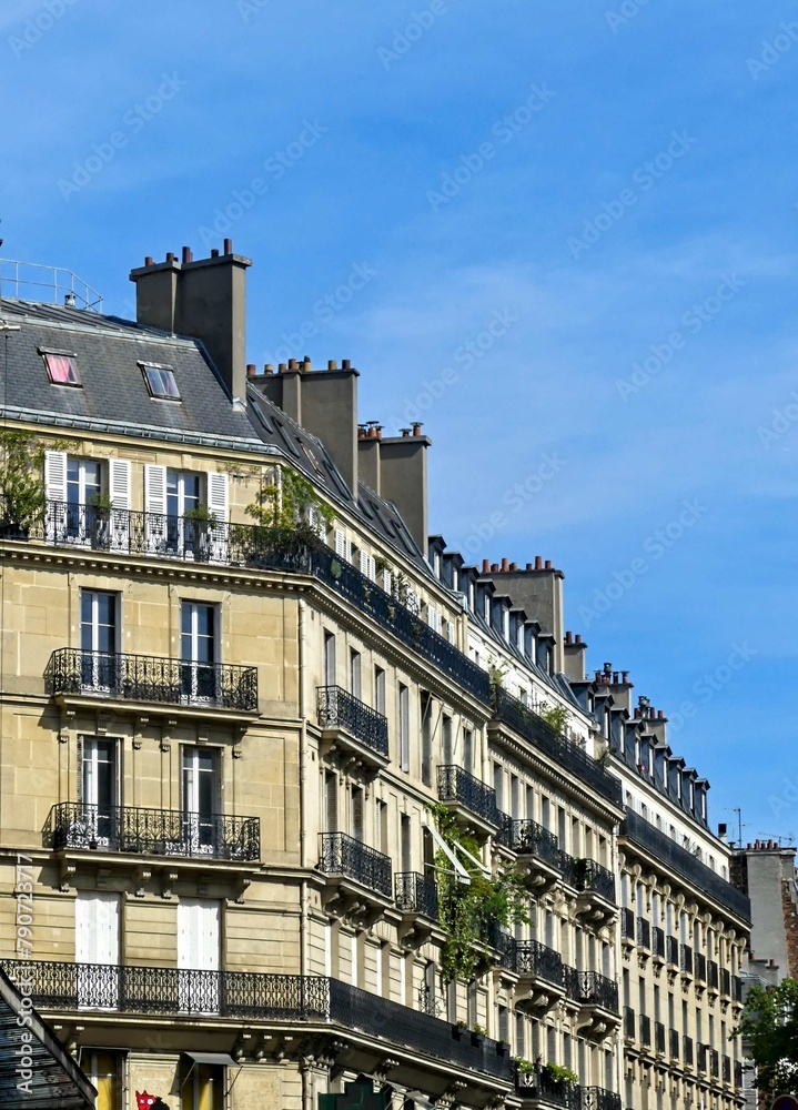 Paris, September 2022 : Visit of the magnificent city of Paris, Capital of France - View on different facades of buildings built by Baron Haussmann