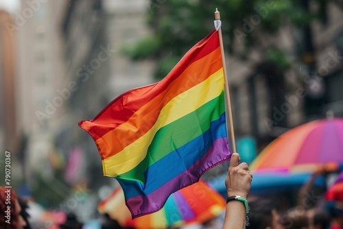 group holding a rainbow flag