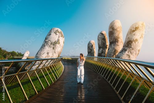 Traveler Walking on the Golden Bridge in Bana hills, enjoying the morning , Danang Vietnam