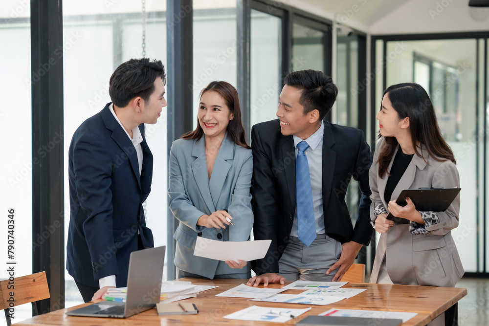 Female business leader presenting graphs to team. Leadership and business strategy concept. Female business leader presenting graphs to team. Leadership and business strategy concept.