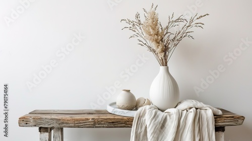 Dehydrated Lagurus ovatus grass in a contemporary white ceramic vase 