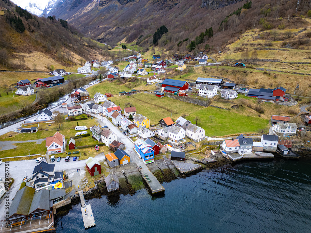 Fishing village Undredal against mountain near the Flam in Norway.