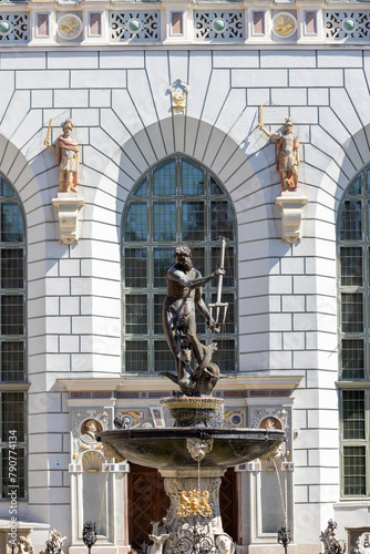 17th century Neptune's Fountain Statue at Long Market Street by the entrance to Artus Court, Gdansk, Poland