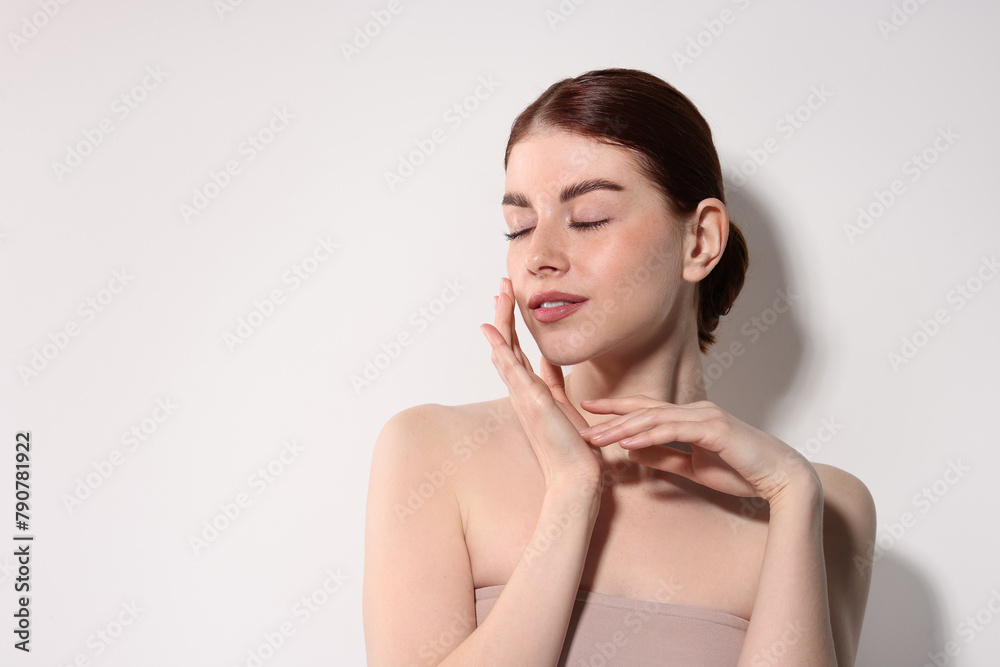 Portrait of beautiful woman on light background. Space for text Portrait of beautiful woman on light background. Space for text