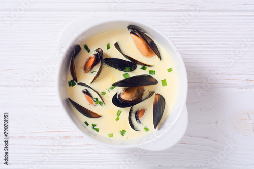 Cream soup with mussels . Sea food background photo
