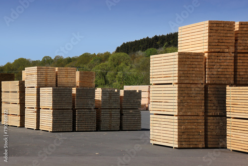 Stacks of squared timber beams stored at a sawmill in Germany