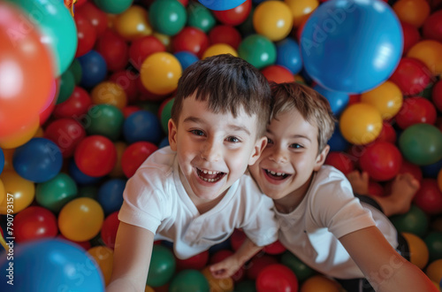 happy kids playing in a ball pit, with colorful balls everywhere