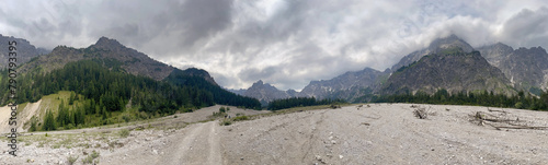 Panoramic view across the Wimbachtal mountain range with a dry river bed