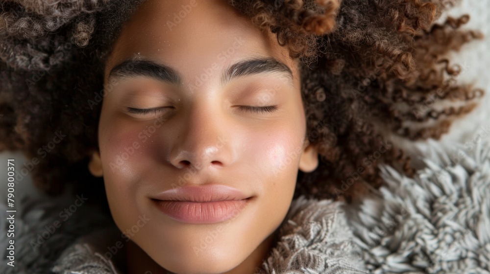 Serene Young Woman with Curly Hair Resting Peacefully